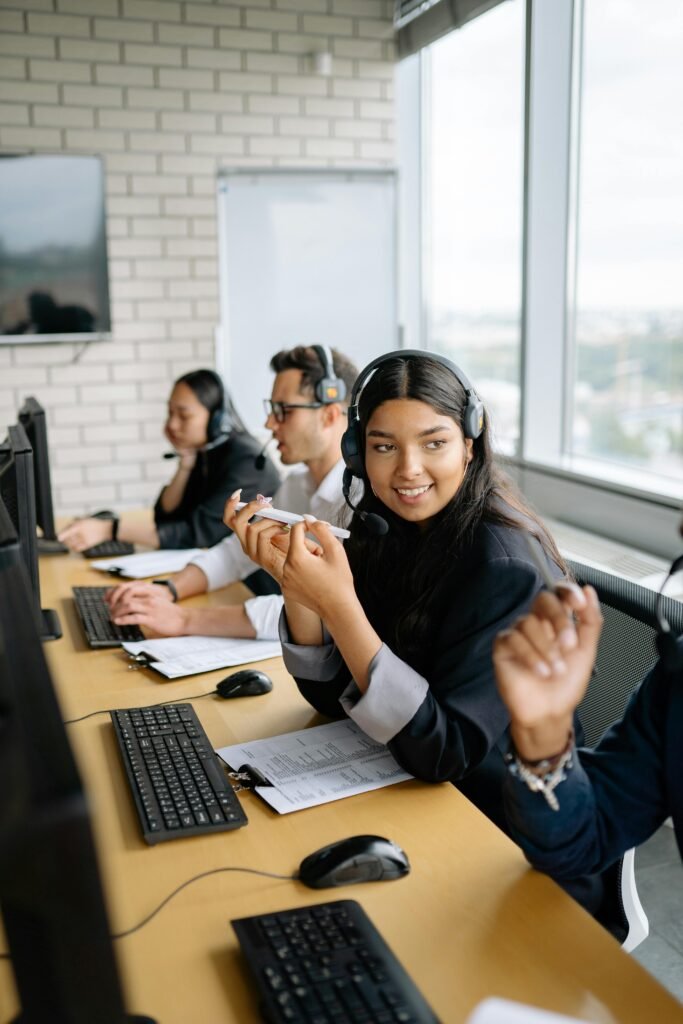 Professional call center team engaged in discussions, showcasing diversity and teamwork.